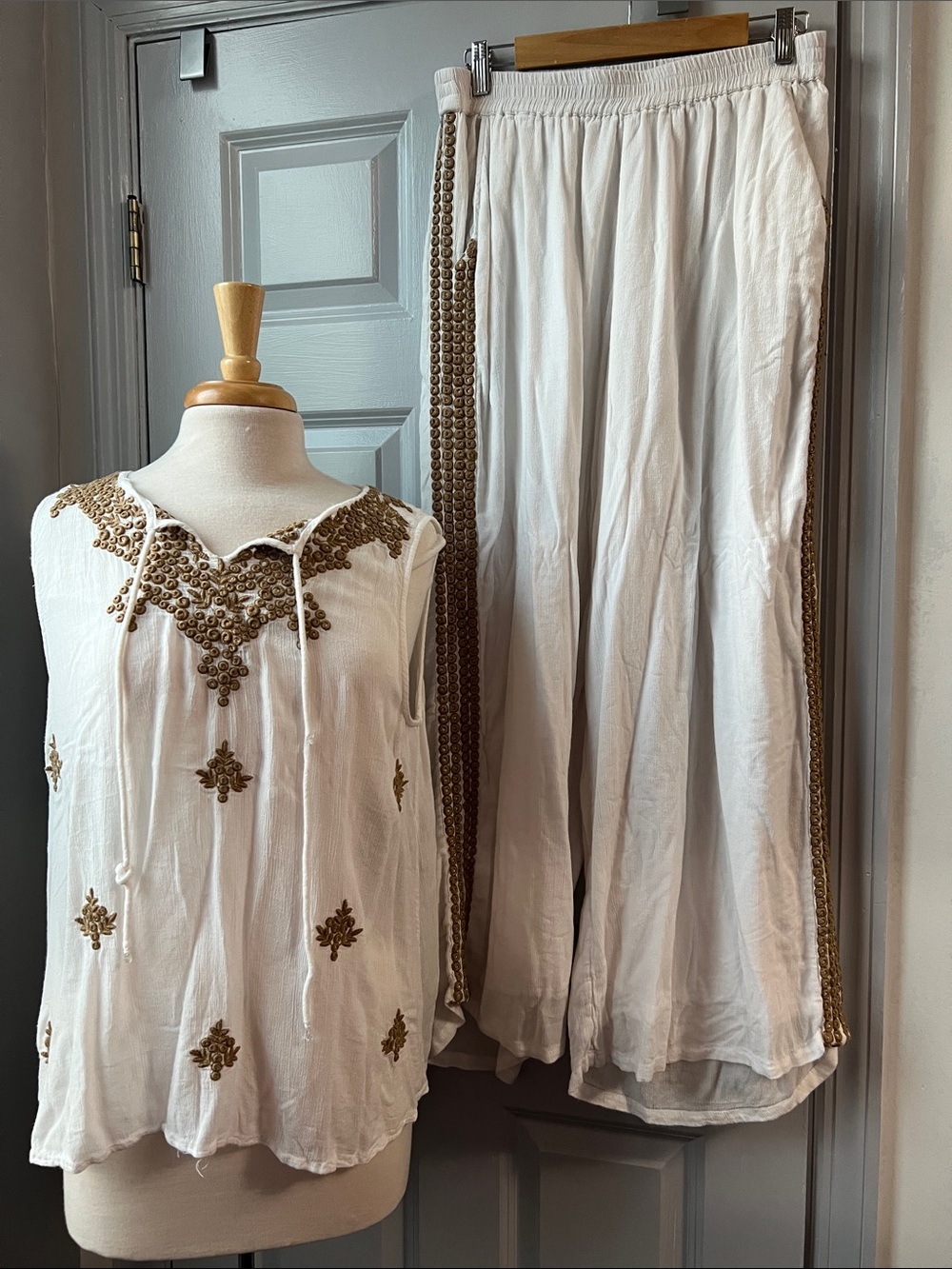 White Embroidered Sleeveless Tunic Top and Flowy Pants with Gold Accents